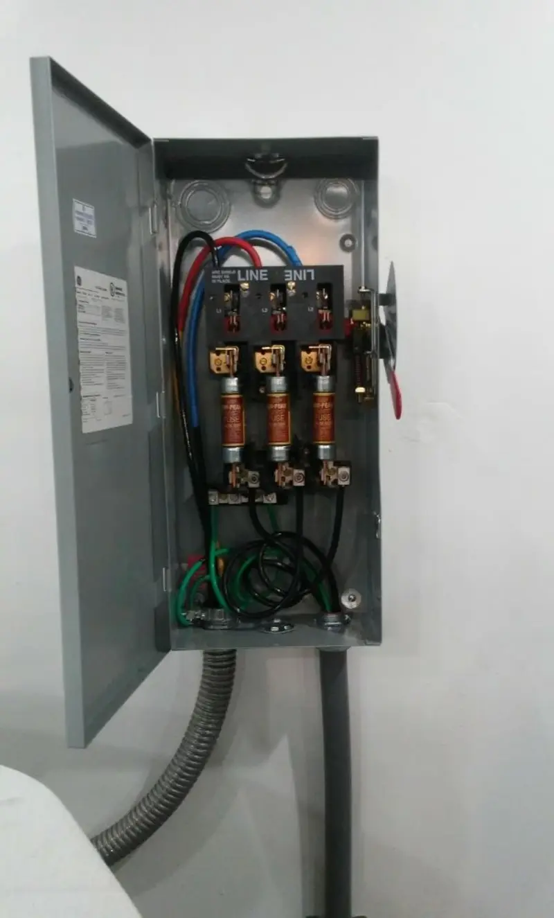 Three-phase disconnect switch installed for Smoke Detector Installation in Normandy