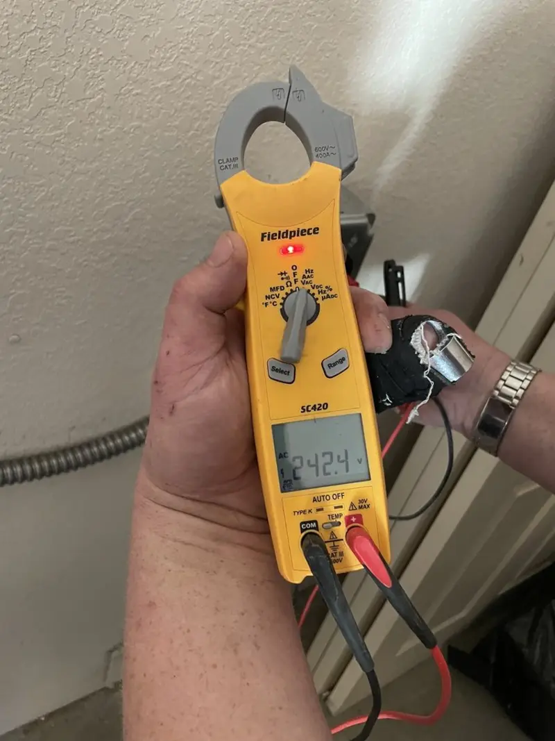 Voltage testing with clamp meter during Hot Tub / Pool Electrical Wiring in Normandy